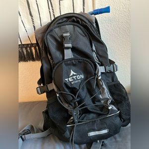 Teton Oasis 18L hydration pack with 2L bladder pack. Used